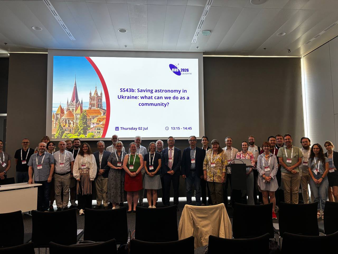 Participants of the special session Saving astronomy in Ukraine standing in front of the SS43b title slide at EAS 2026 in Lausanne.